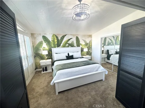 a bedroom with a bed and window