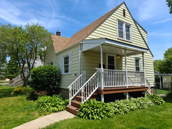 a view of a house with a small yard