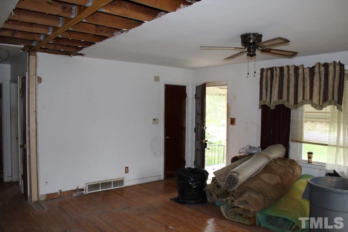 1811 Charles Street Raleigh, NC 27610 - Photo 2 of 16 a living room with furniture windows and a ceiling fan
