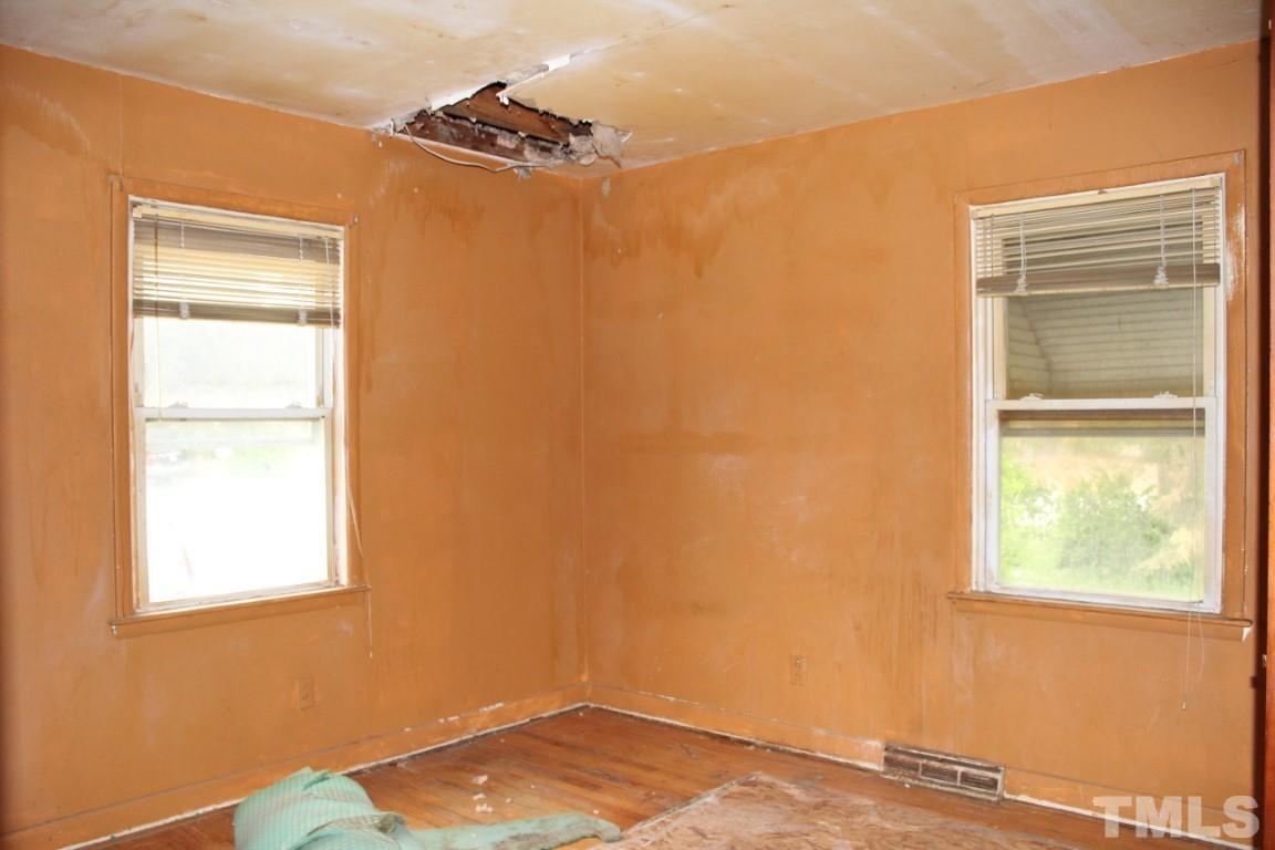 1811 Charles Street Raleigh, NC 27610 - Photo 9 of 16 a view of an empty room with a window