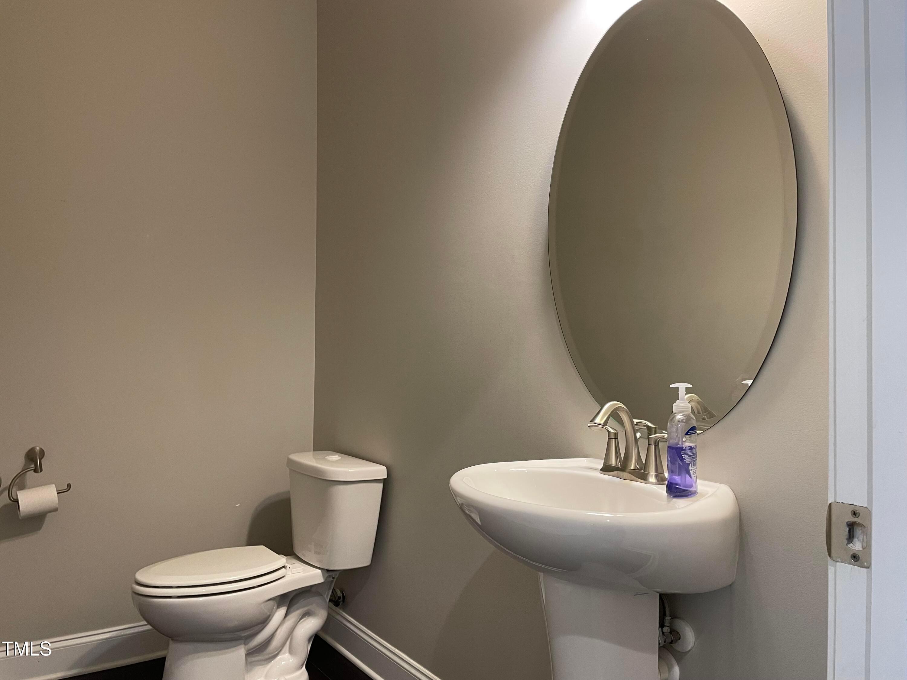 1809 Capstone Drive Durham, NC 27713 - Photo 16 of 35 a bathroom with a sink and a toilet