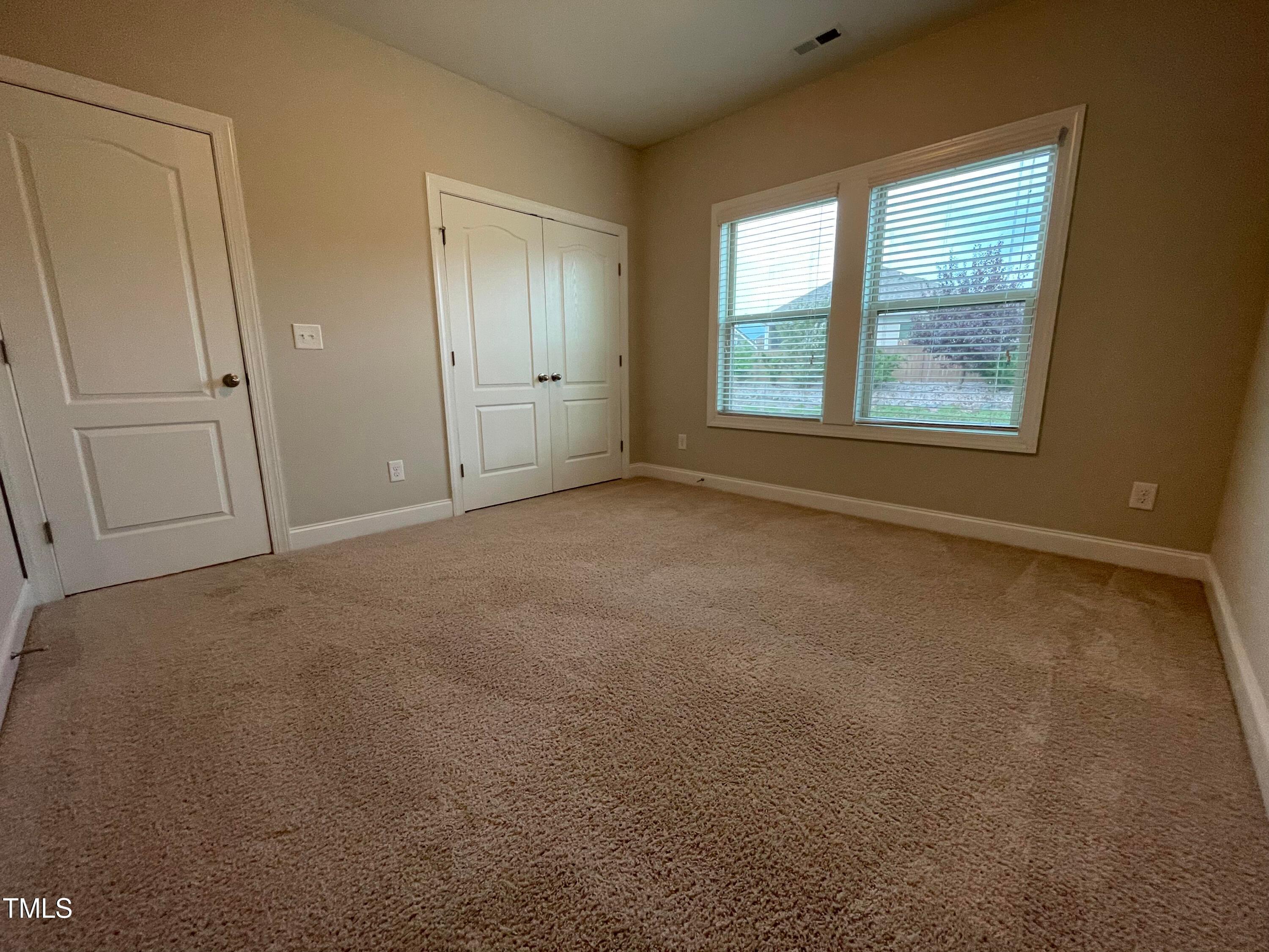 1809 Capstone Drive Durham, NC 27713 - Photo 18 of 35 an empty room with windows