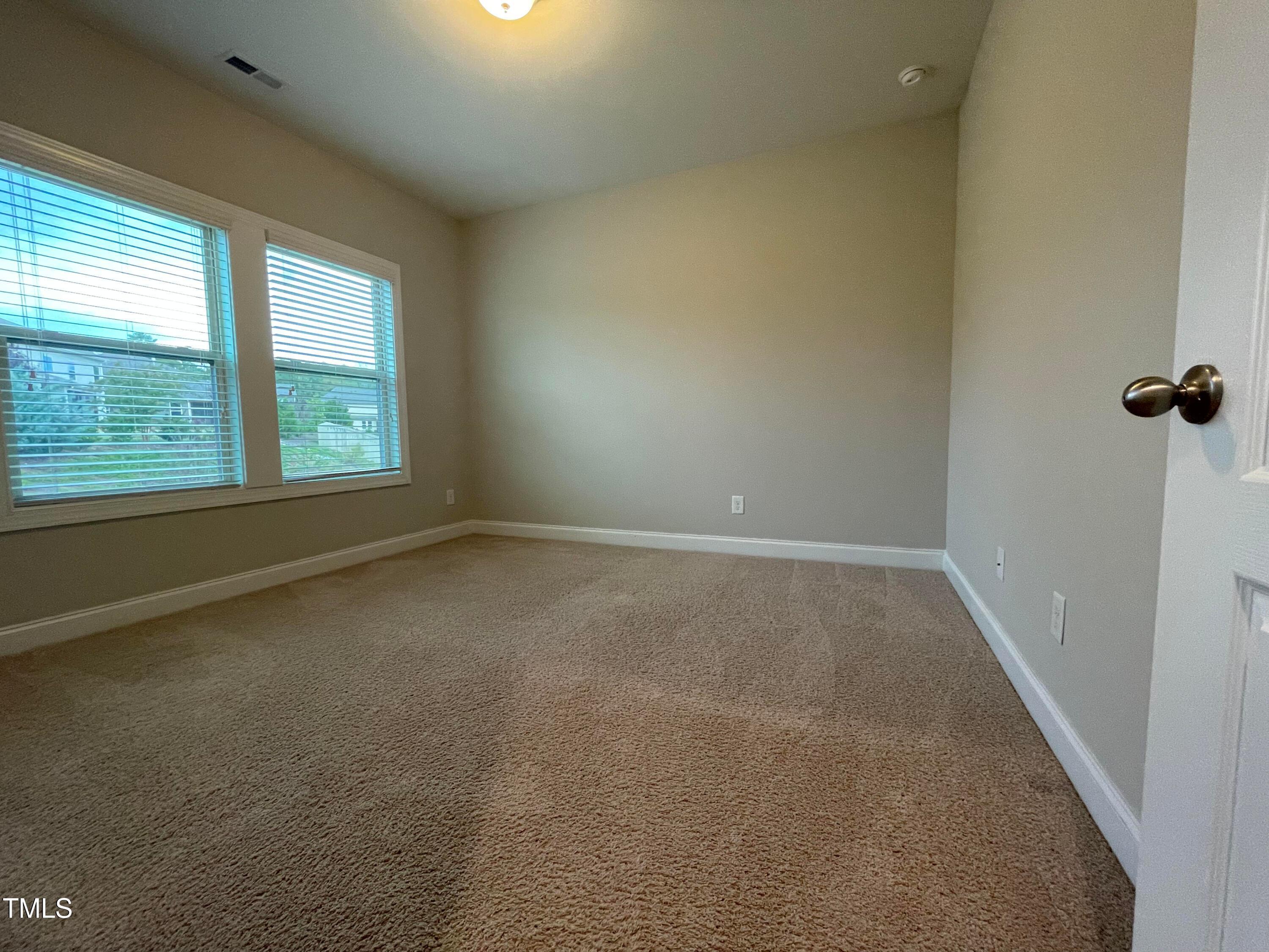 1809 Capstone Drive Durham, NC 27713 - Photo 21 of 35 an empty room with a window