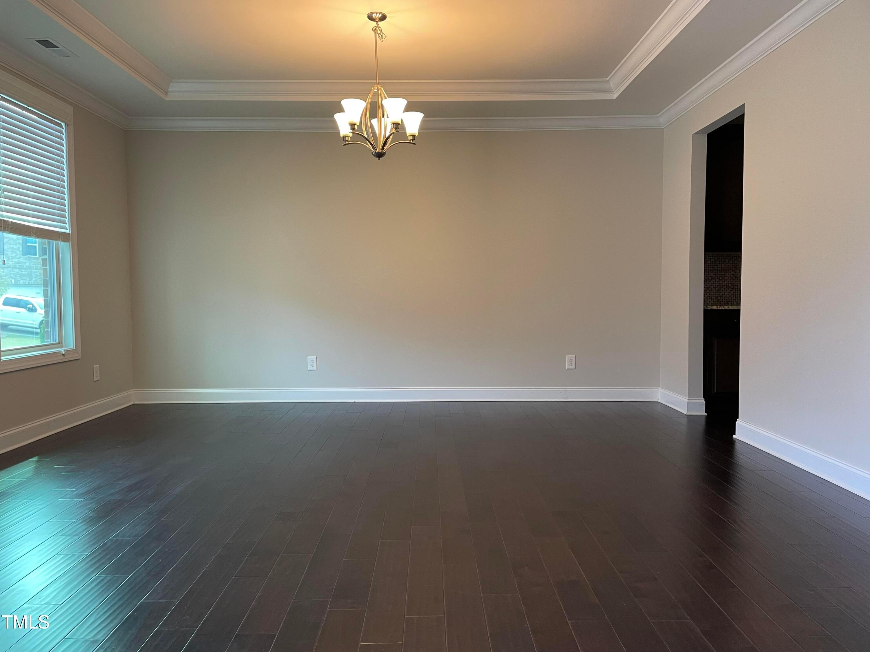 1809 Capstone Drive Durham, NC 27713 - Photo 7 of 35 wooden floor in an empty room with a window