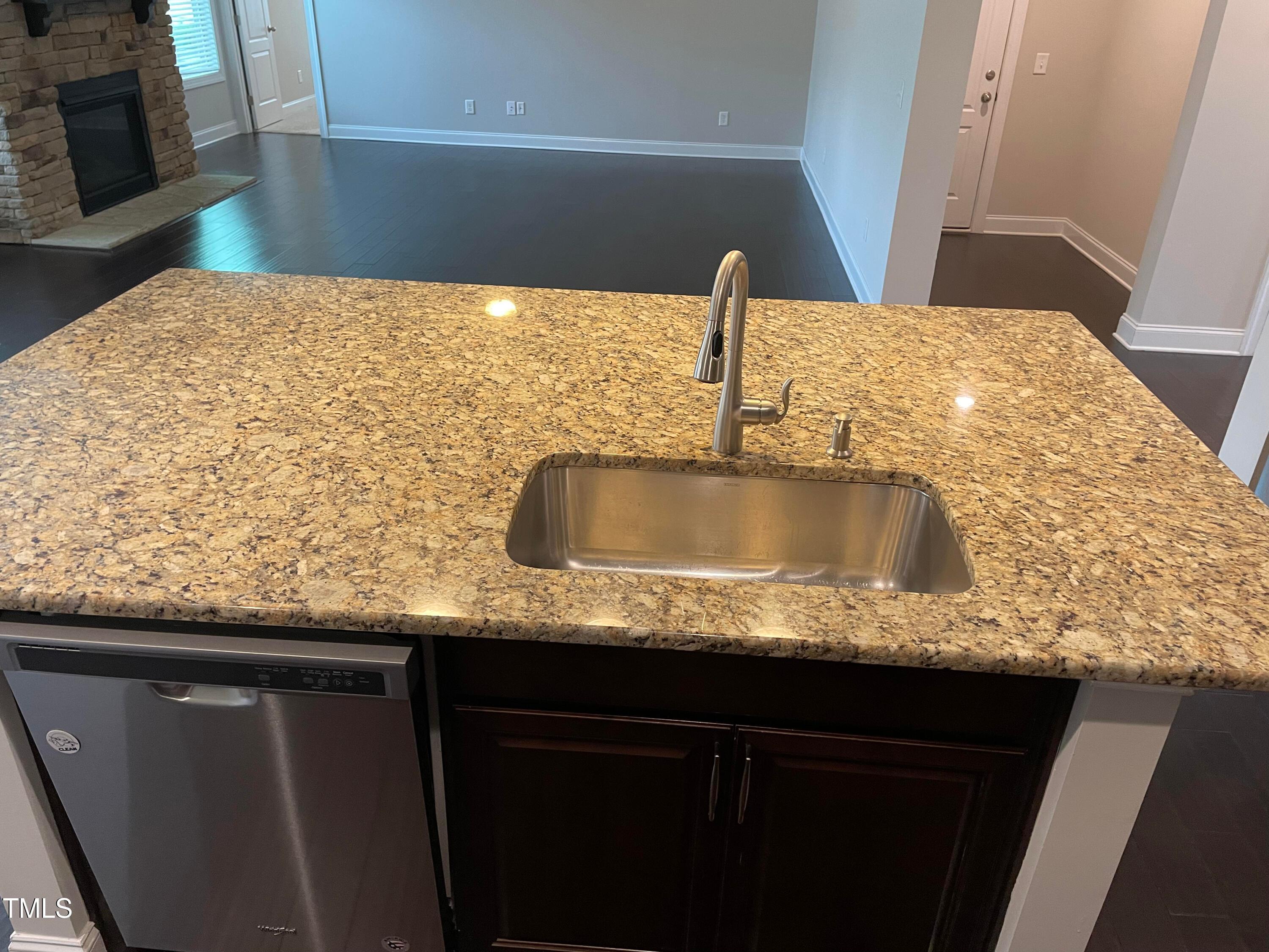 1809 Capstone Drive Durham, NC 27713 - Photo 10 of 35 a kitchen with granite countertop a sink and a stove