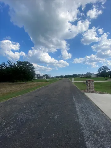 a view of a lake with a big yard