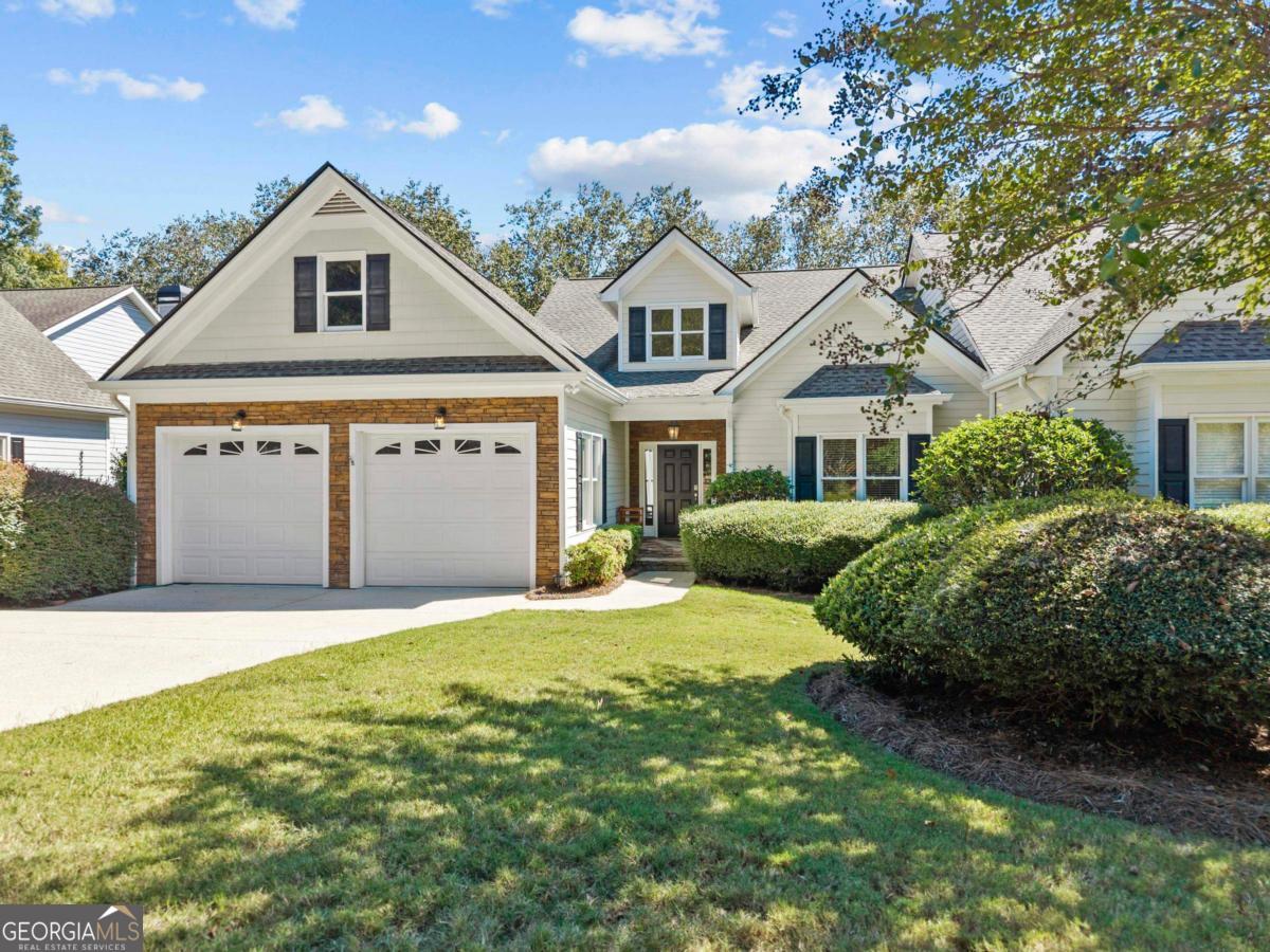 1540 Vintage Club Road Greensboro, GA 30642 - Photo 1 of 71 a front view of a house with a garden and yard