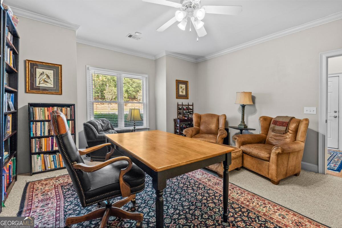 1540 Vintage Club Road Greensboro, GA 30642 - Photo 20 of 71 a view of a livingroom with furniture and a book shelf