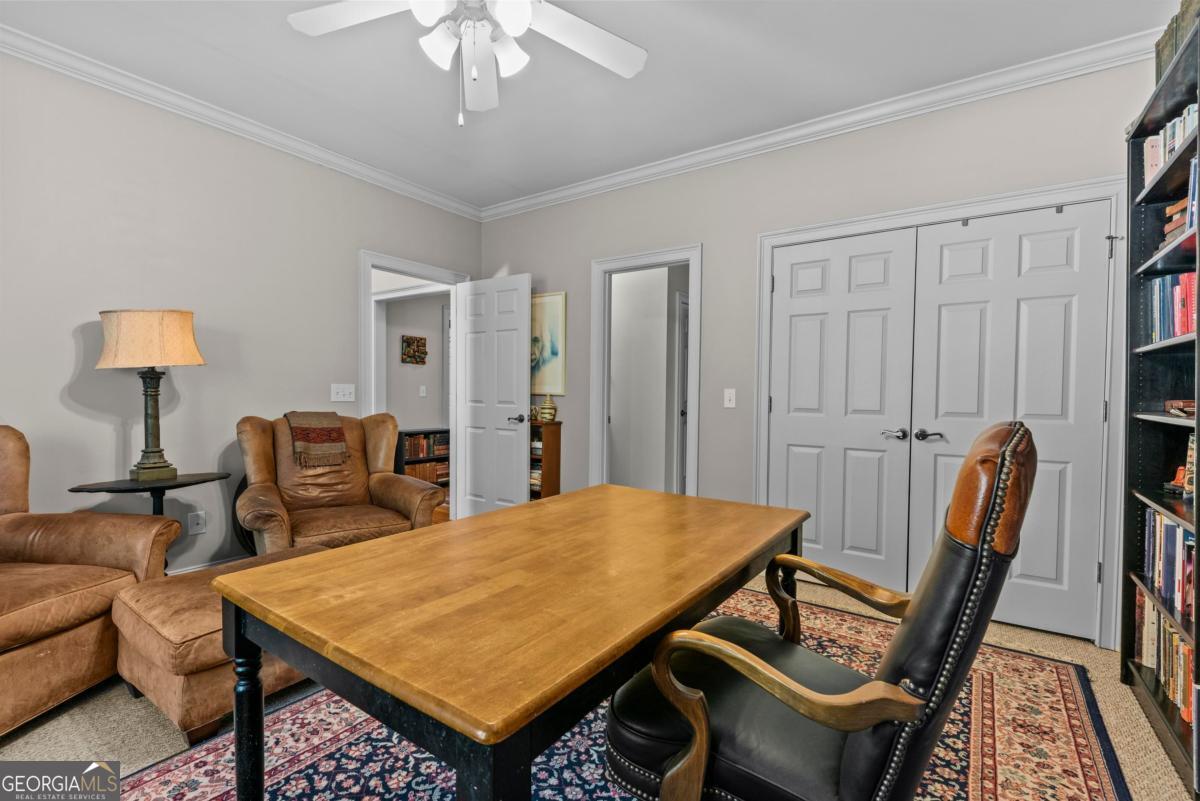 1540 Vintage Club Road Greensboro, GA 30642 - Photo 21 of 71 a view of a livingroom with furniture and a table
