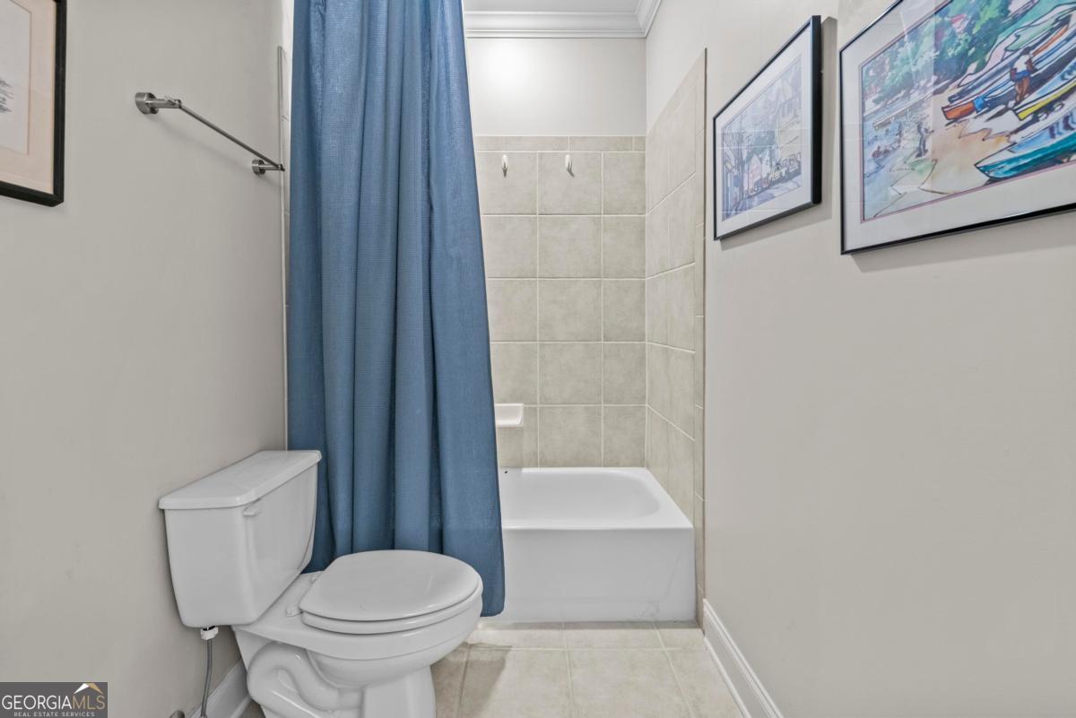 1540 Vintage Club Road Greensboro, GA 30642 - Photo 22 of 71 a bathroom with a toilet and a shower