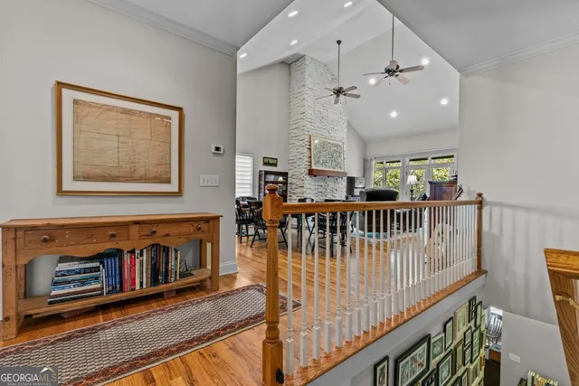 a living room with furniture a fireplace and a kitchen view