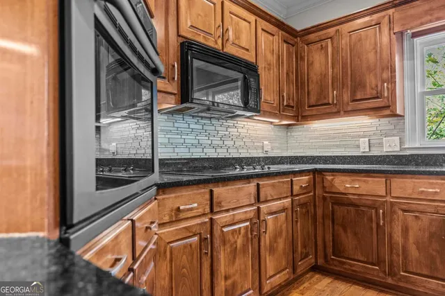a view of a lake with a bench and wooden floor