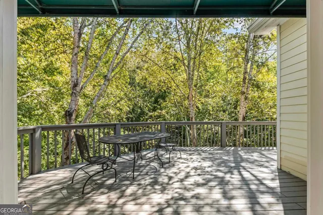 a en suite bathroom with a sink double vanity and a mirror