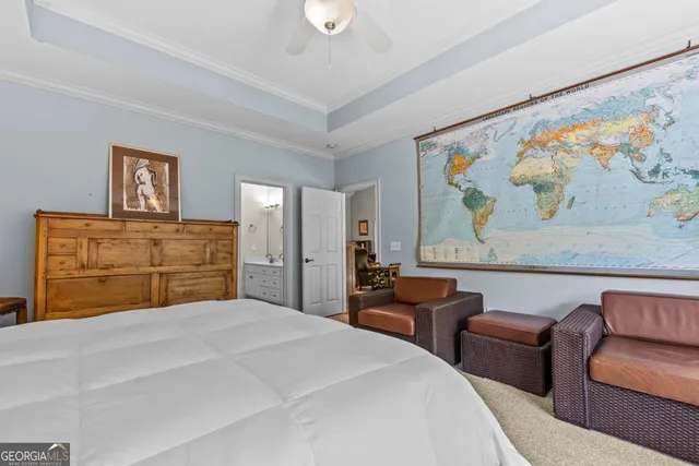 a bedroom with a bed and a television