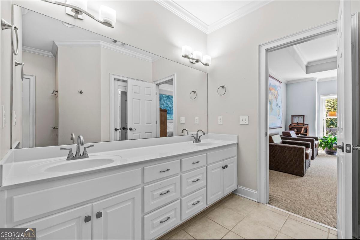1540 Vintage Club Road Greensboro, GA 30642 - Photo 46 of 71 a bathroom with double sink and a mirror