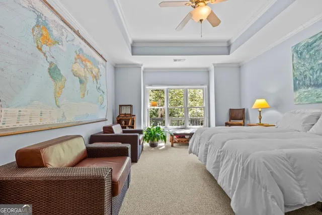 a front view of a house with a garden and trees