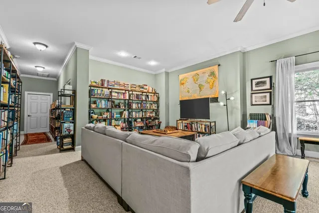 an aerial view of a house with a yard and lake view