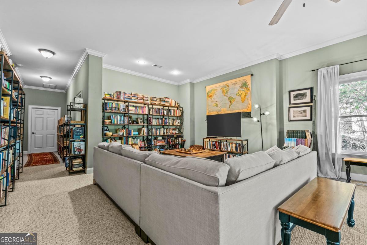 1540 Vintage Club Road Greensboro, GA 30642 - Photo 50 of 71 a living room with furniture and a flat screen tv
