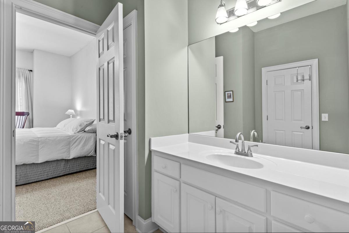 1540 Vintage Club Road Greensboro, GA 30642 - Photo 57 of 71 a en suite bathroom with a sink double vanity and a mirror