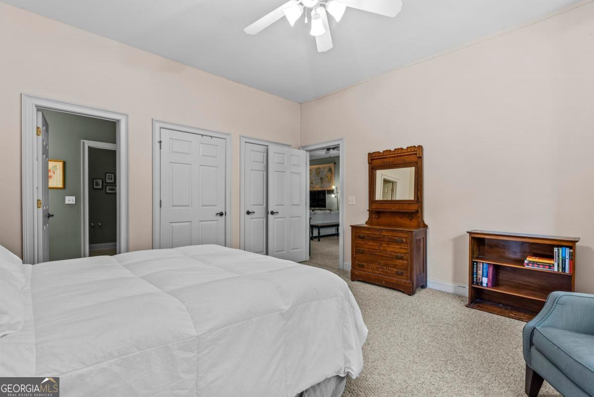 1540 Vintage Club Road Greensboro, GA 30642 - Photo 59 of 71 a bedroom with a bed and a television