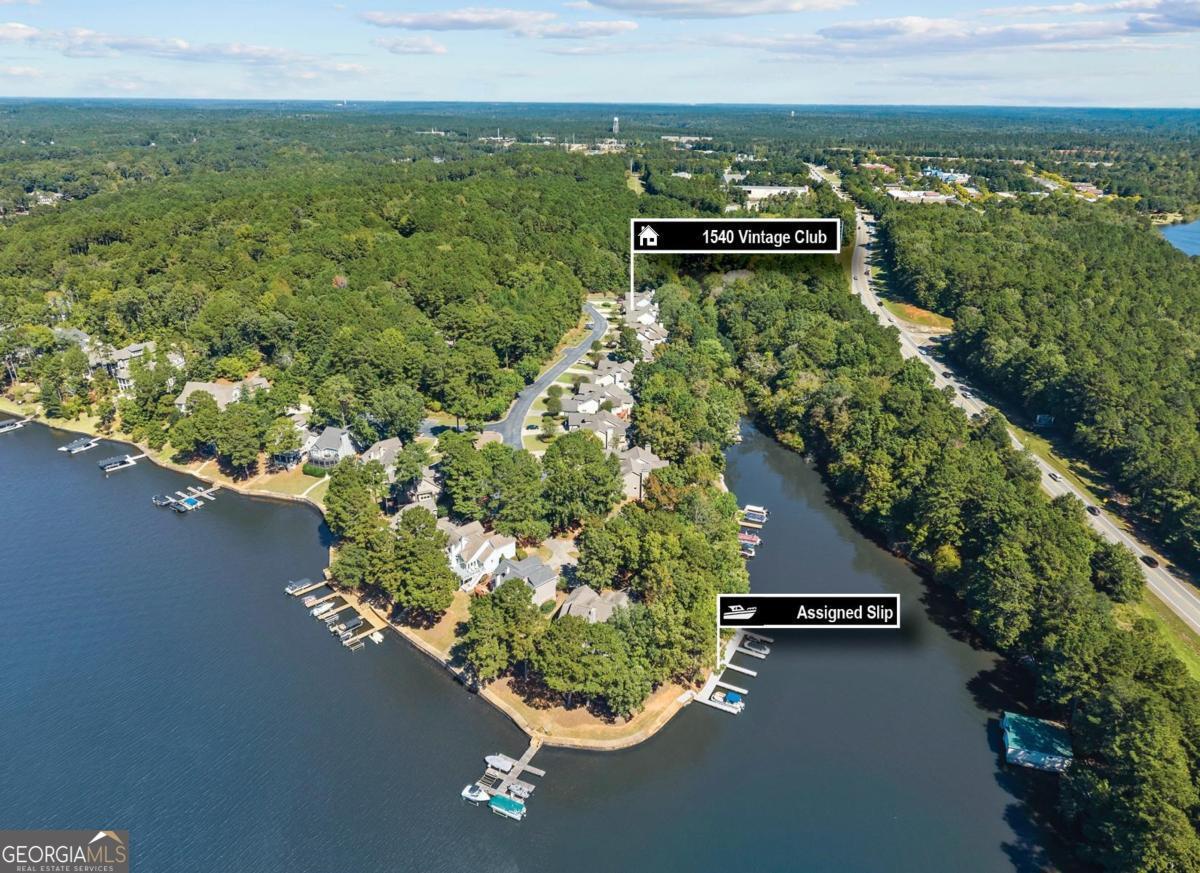 1540 Vintage Club Road Greensboro, GA 30642 - Photo 70 of 71 an aerial view of a house with a yard and lake view