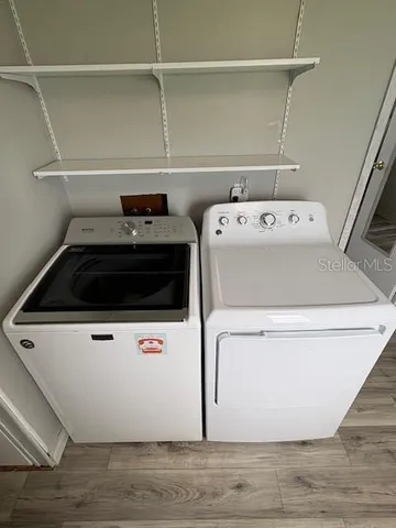 a utility room with dryer and washer