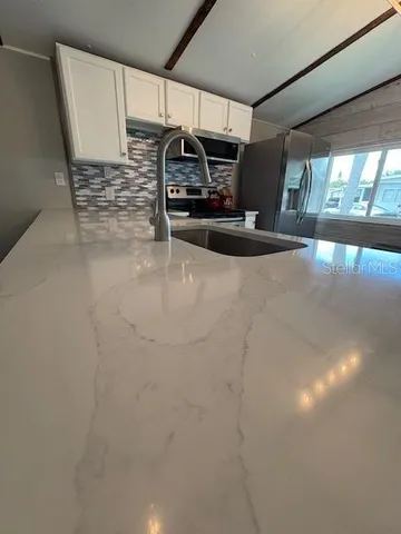 a view of a garage with an empty space