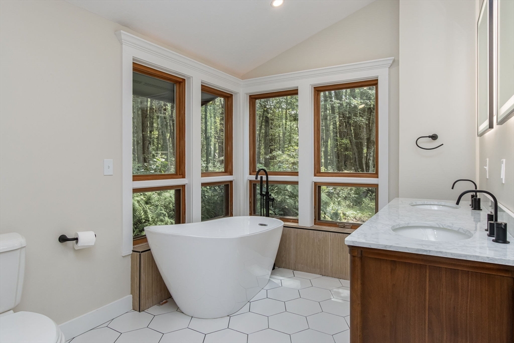 97 Old Mill Road Harvard, MA 01451 - Photo 18 of 29 a living room with a large window and a table