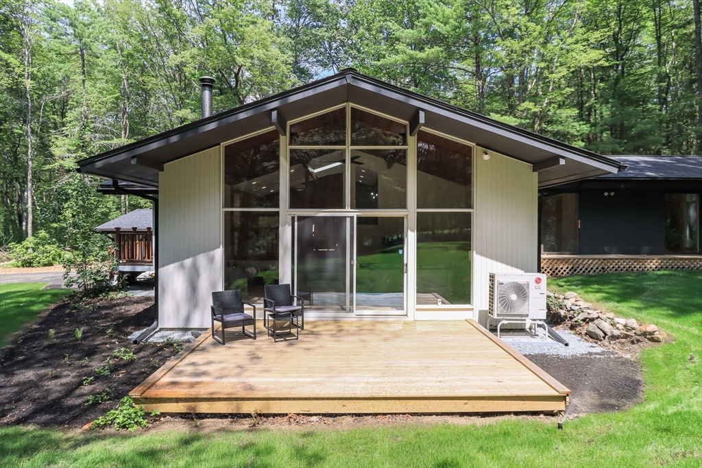 97 Old Mill Road Harvard, MA 01451 - Photo 25 of 29 a view of a house with backyard and sitting area