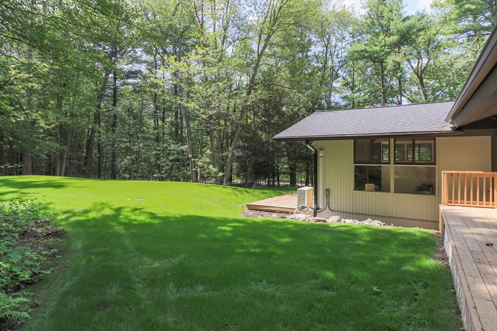 97 Old Mill Road Harvard, MA 01451 - Photo 27 of 29 a view of a house with a yard and a large tree