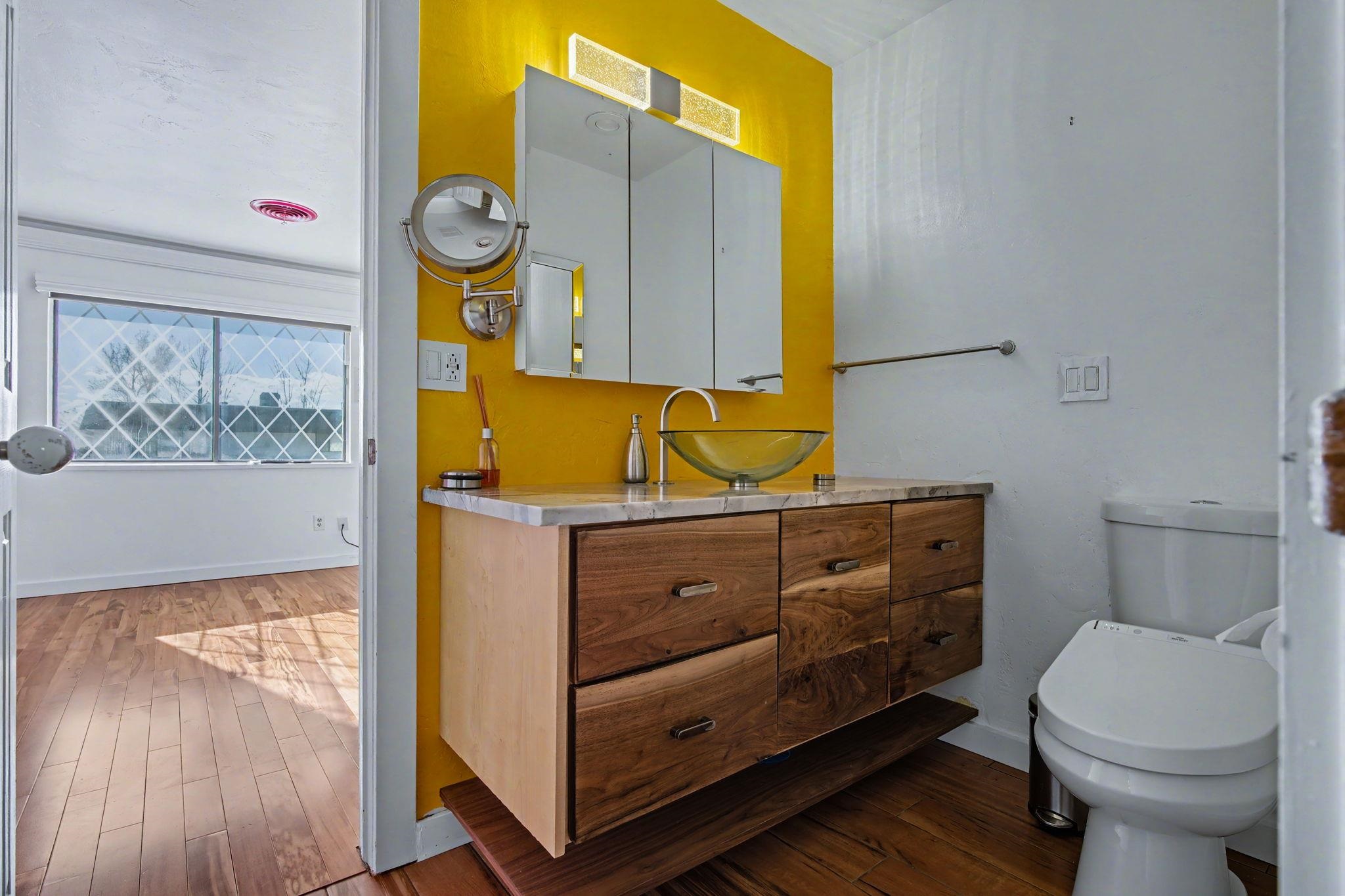 2700 G Road, Unit 12F Grand Junction, CO 81506 - Photo 20 of 24 a bathroom with a sink a toilet and a mirror
