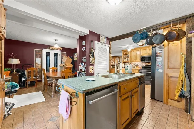 a living room with lots of furniture and refrigerator