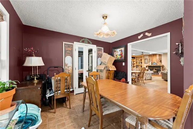 a living room with lots of furniture and kitchen view