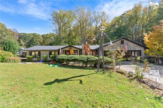 a view of a patio with table and chairs and potted plants
