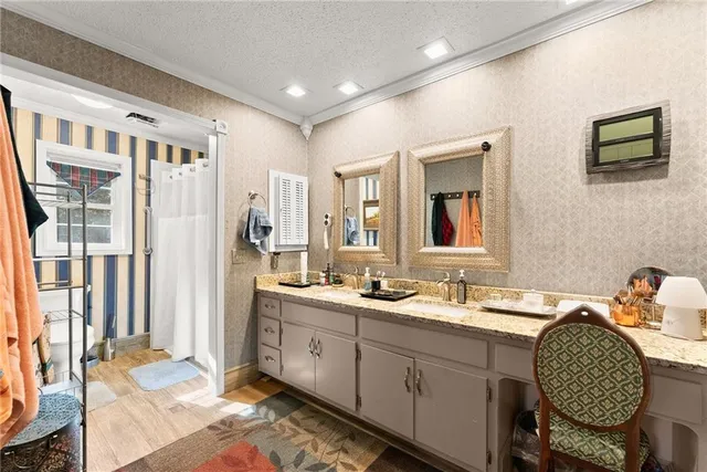 a bathroom with a sink a mirror and a toilet