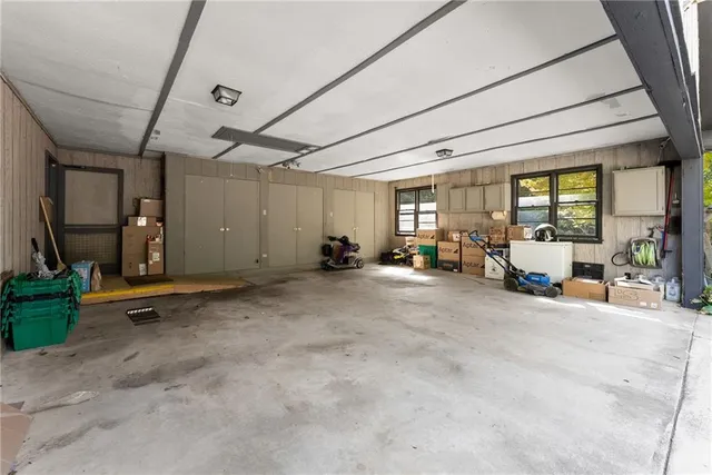 a front view of a house with a garden and entertaining space