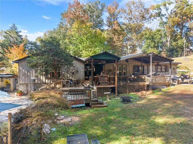 a view of a backyard with sitting area