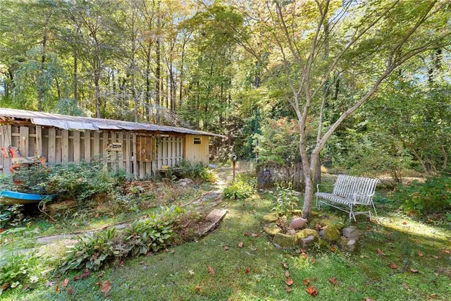 a view of a building with a cars parked in front of it