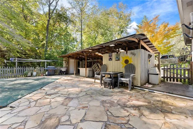 a view of a car park in front of a house