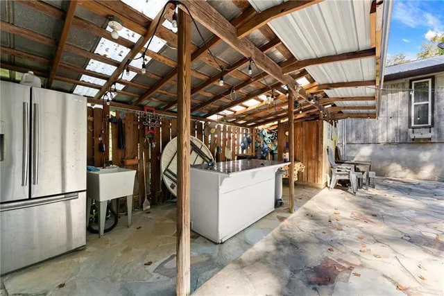 a bathroom with a toilet sink vanity tub and mirror