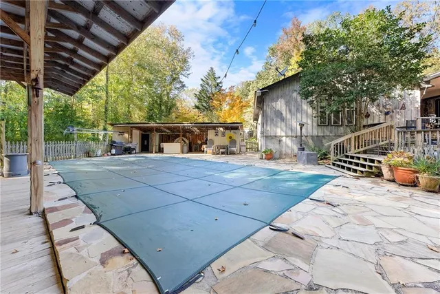 a room with furniture and a chandelier fan