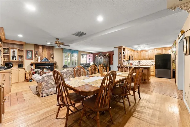 a kitchen with stainless steel appliances granite countertop a refrigerator stove top oven a sink and dishwasher