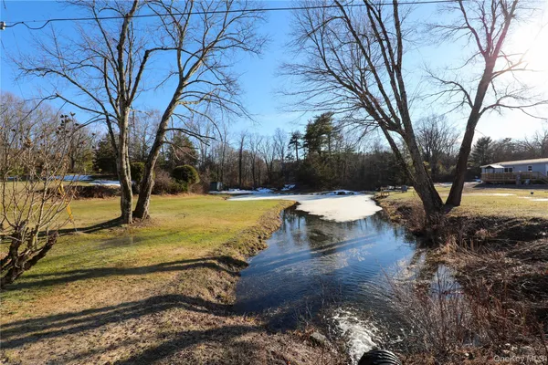 a view of a yard with swimming pool