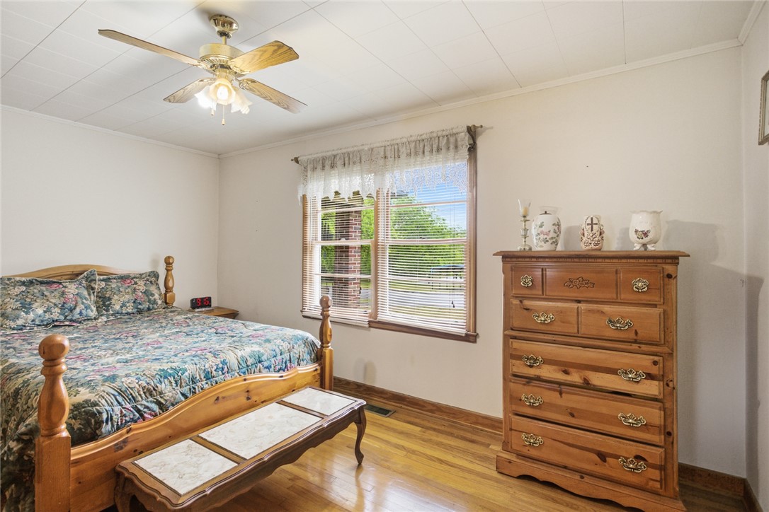 282 West Bennett Road Westminster, SC 29693 - Photo 16 of 42 This restful bedroom features hardwood floors and a bright window, creating a warm and inviting atmosphere.