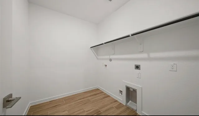 a view of storage and utility room with empty racks