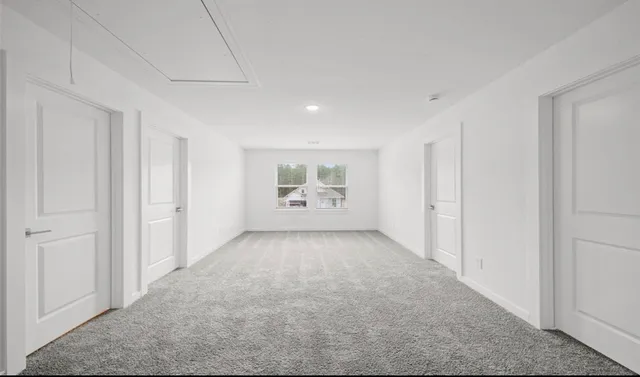 a view of an empty room and window