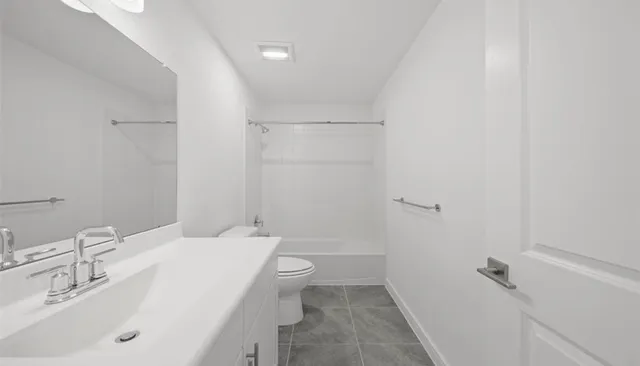 a bathroom with a sink and toilet