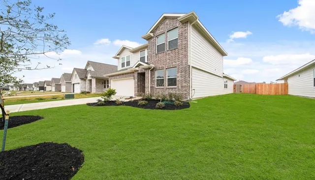 a front view of house with yard and outdoor seating
