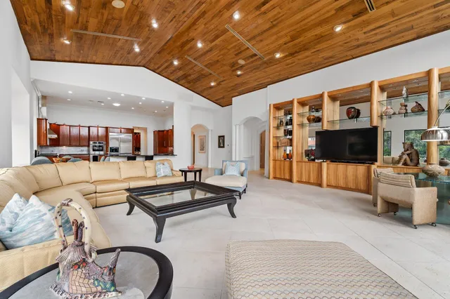 an aerial view of a houses with a lake view