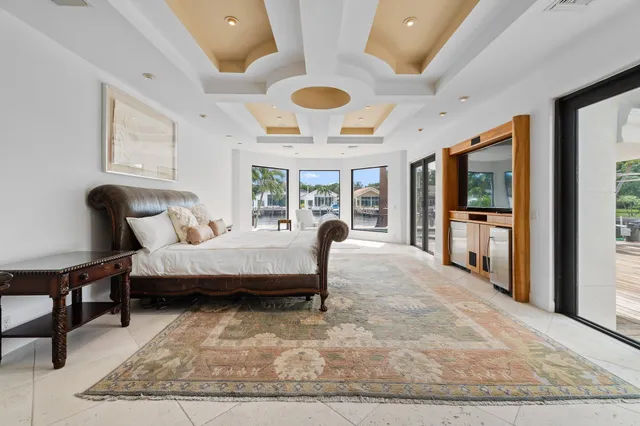 an aerial view of a city with lots of residential buildings lake and ocean view